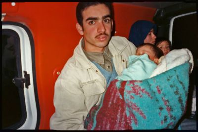 Palestinian familiy taking baby to hospital